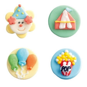4 décorations en sucre motifs cirque : clown, chapiteau, popcorn et ballons